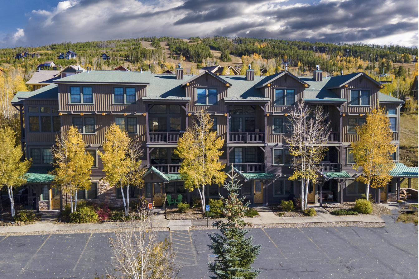 Kicking Horse Lodges building in fall with golden aspens